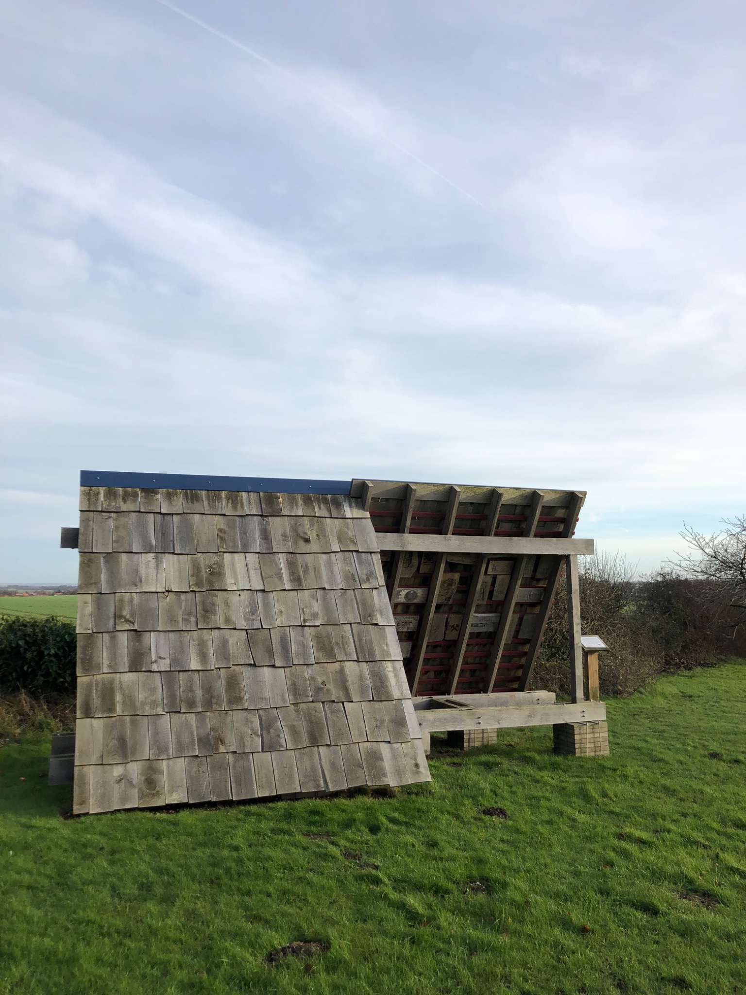 Timber artwork and shelter in the Kent Downs landscape