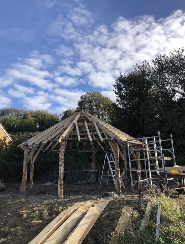 Roundhouse timber posts and roof rafters during construction